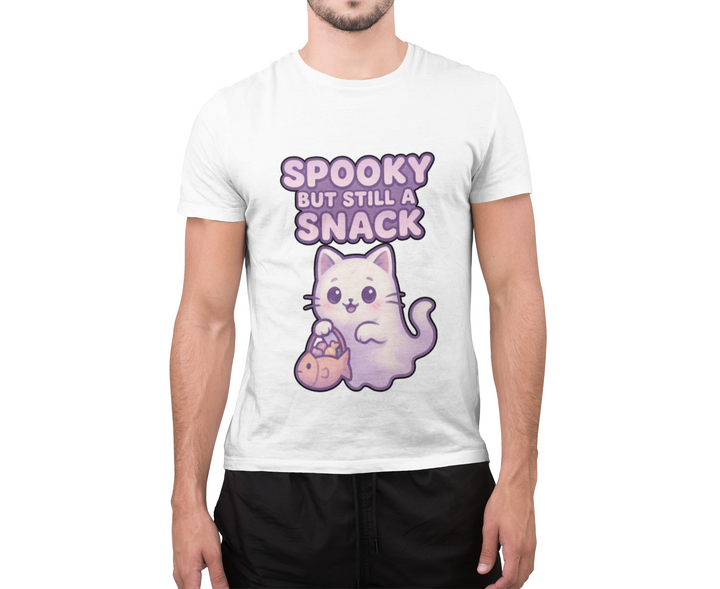 Model wearing a white T-shirt featuring a purple ghost cat holding a candy bag with Spooky but Still a Snack lettering.