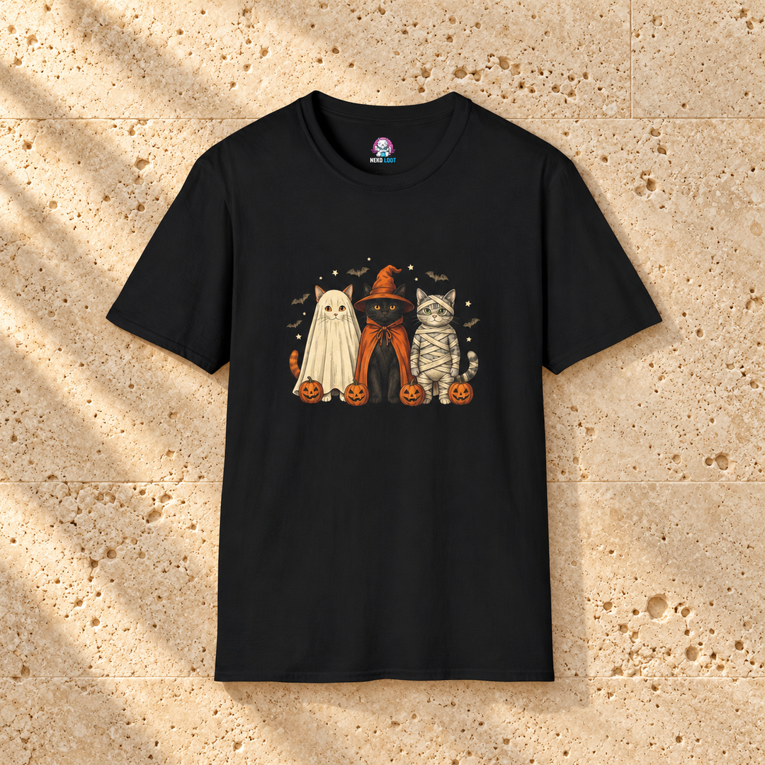 Halloween Cat Trio T-Shirt — black shirt on warm beige travertine