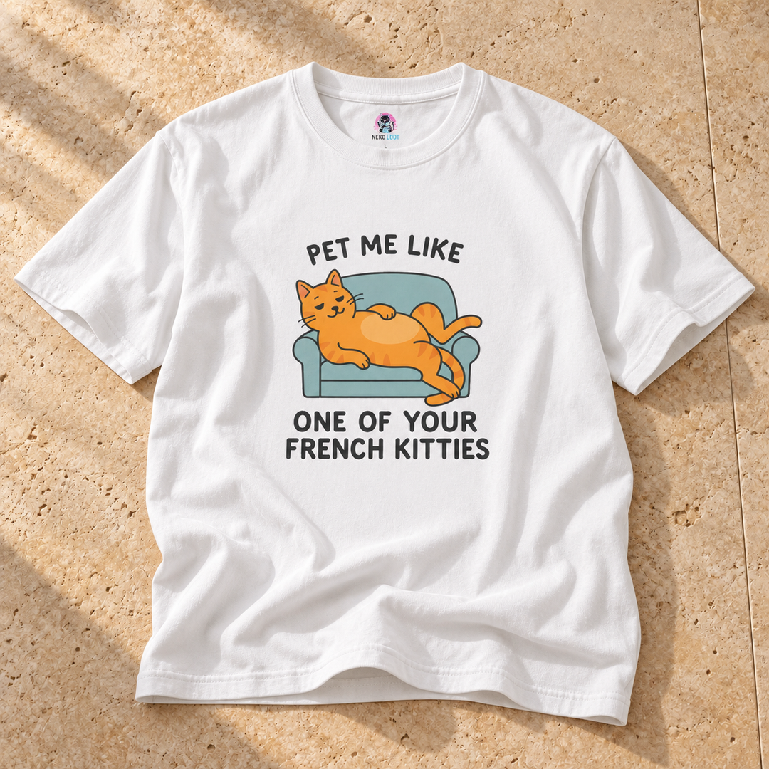 White Pet Me Funny French Cat T-Shirt on warm travertine stone.