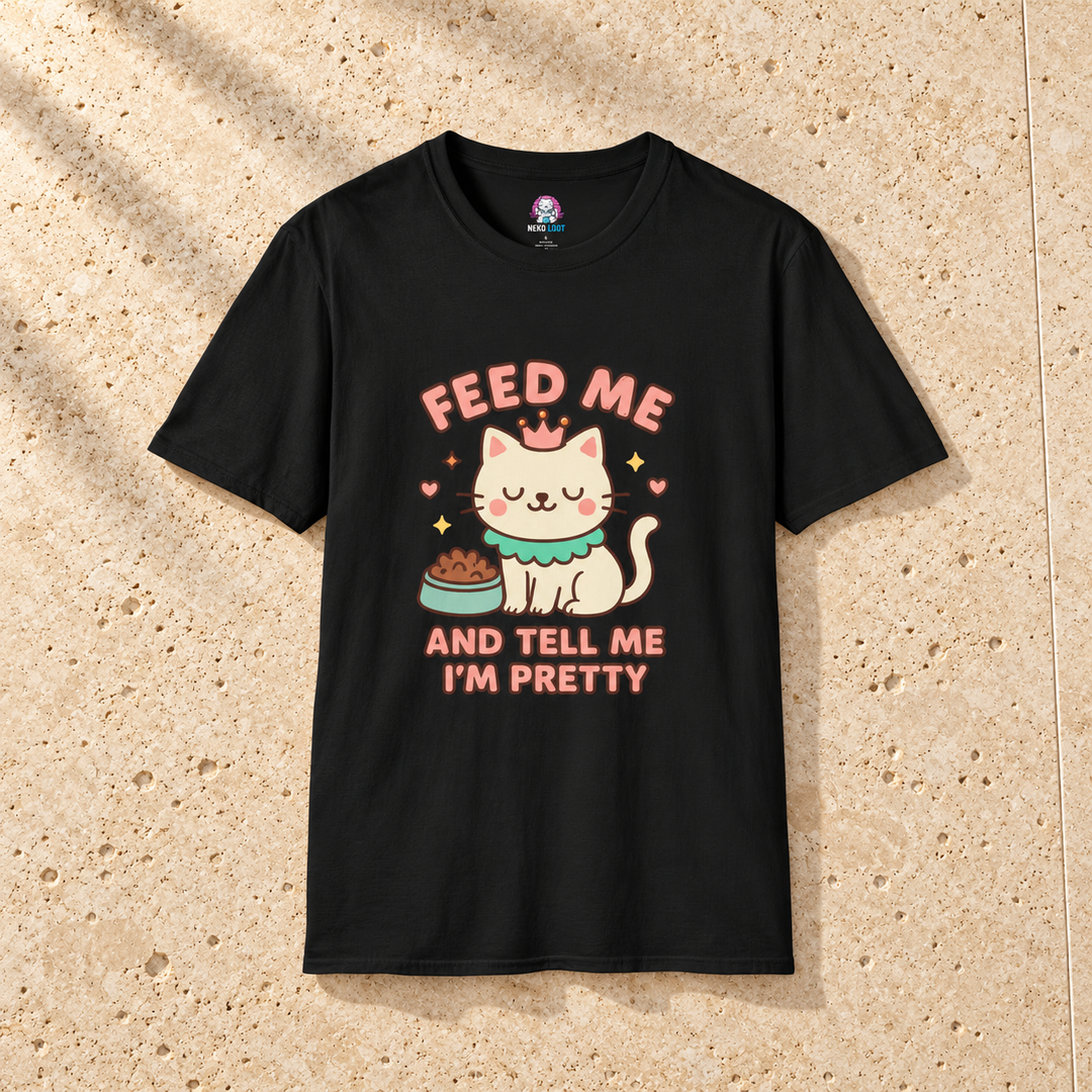 Black Princess Feed Me Cat T-Shirt on warm travertine stone.