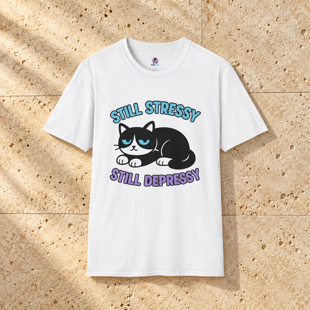 White Stressy, Depressy Cat T-Shirt on warm travertine stone.