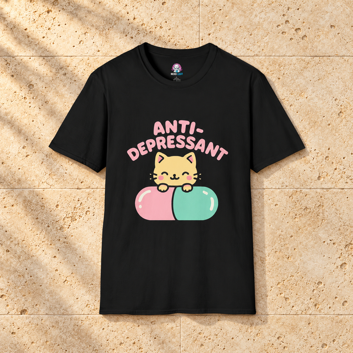 Black Anti-Depressant Cat T-Shirt on warm travertine stone.